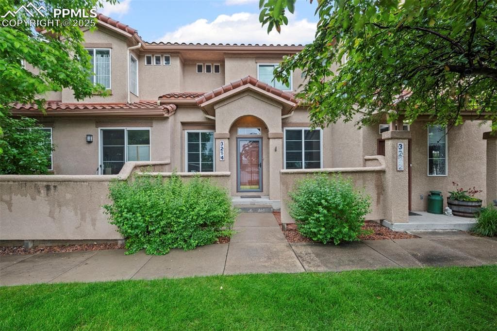 Mediterranean / spanish-style home with stucco siding and a tile roof