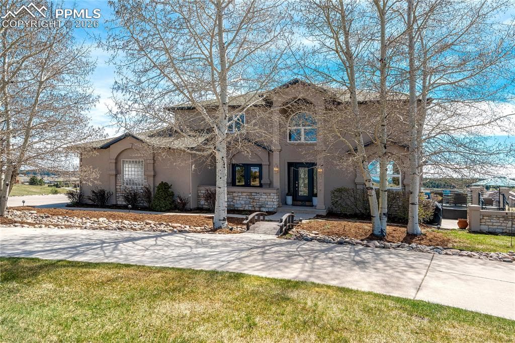 Set on 2.53 acres within Kings Deer, this property captures Pikes Peak views and offers a rare sense of space, privacy, and connection to nature. Surrounded by rolling terrain and mature pines, and anchored by the scenic golf course woven throughout the community, the setting feels both peaceful and refined.