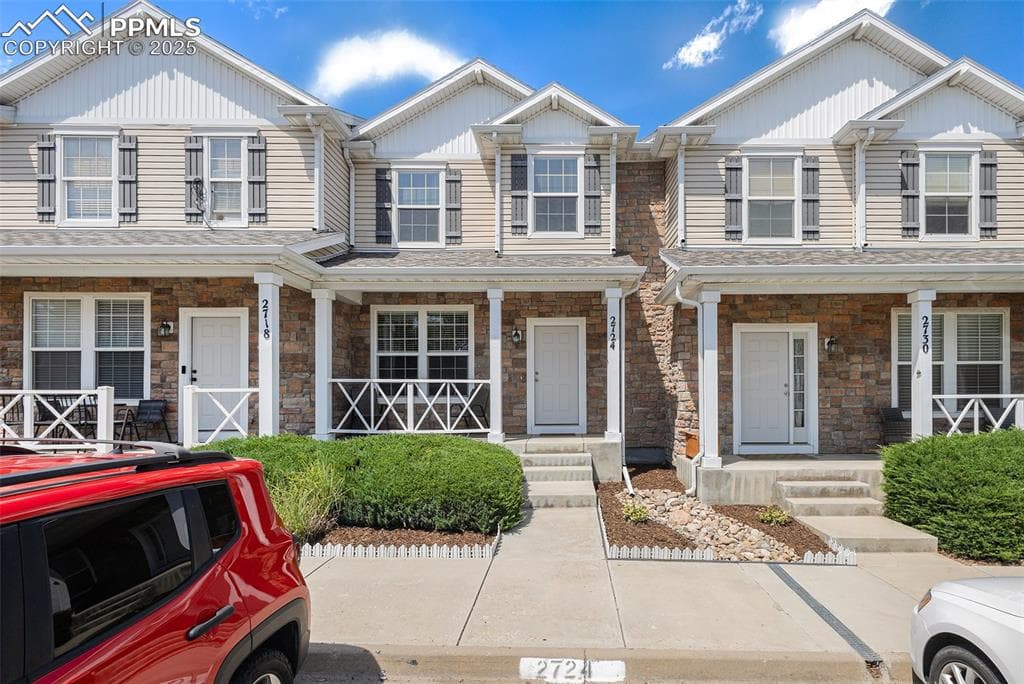 Craftsman-style home featuring a porch and stone siding